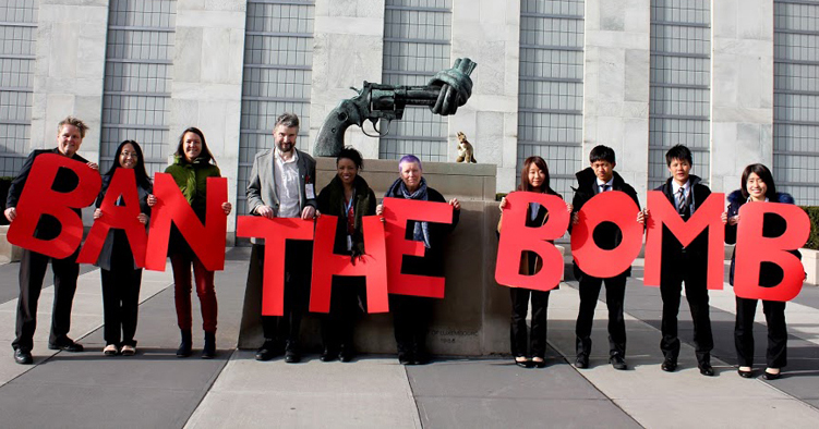 Campaigners hold huge red letters ban the bomb