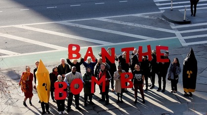 Campaigners outside the Un buildings in New York with the slogan ban the bomb