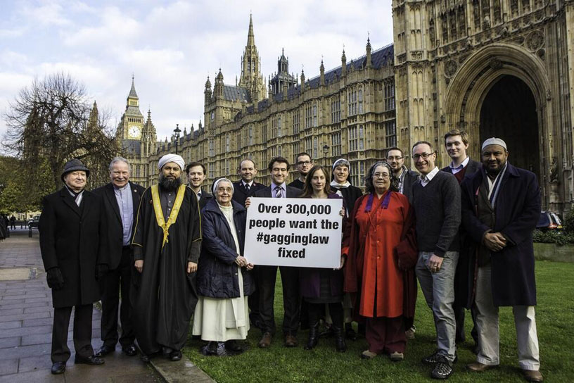 Dozen protest with placard on Lobbying Act, by HoP