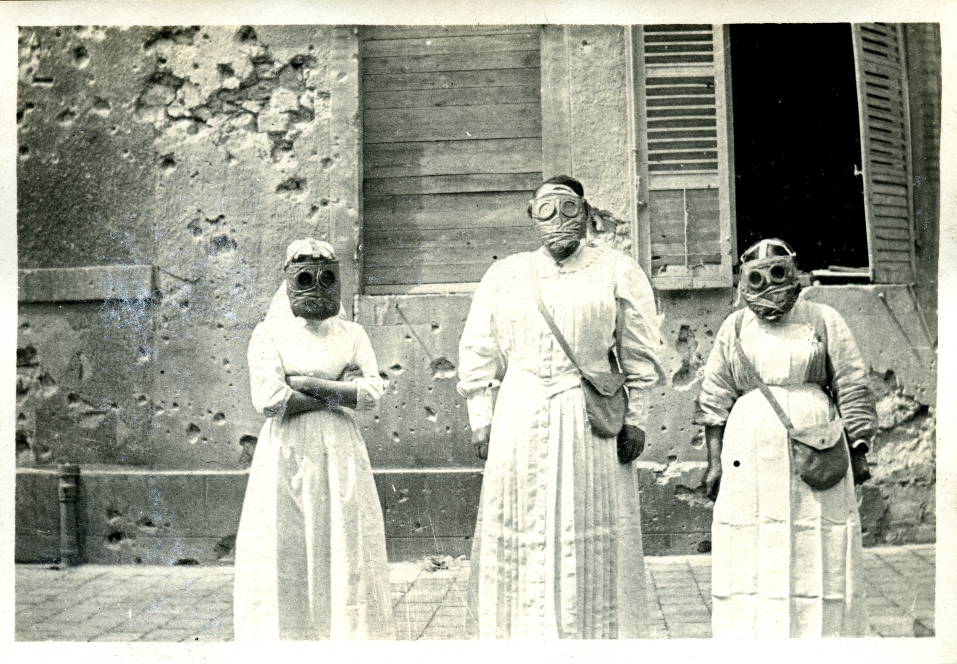 Friends War Victims Relief Committee nurses wearing gas masks