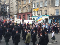 Quaker peace banners behind veterans' parade