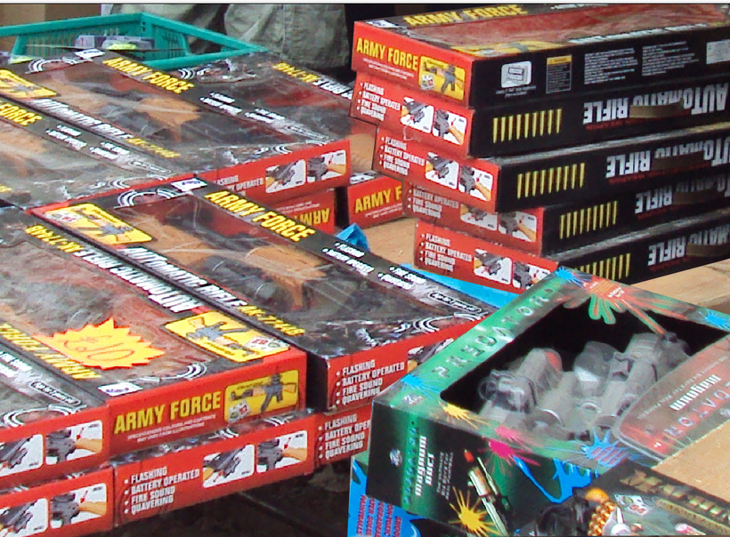 Stacks of toy assault rifles in boxes on sale
