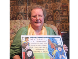 Maria Haines holding a poster from AFSC with the words 'we commit to resisting racism and bigotry by interrogating our own histories, listening and taking action'