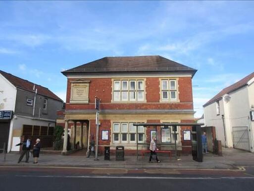 Handsome redbrick house with a stone tablet with 'Quakers' over the entrance.