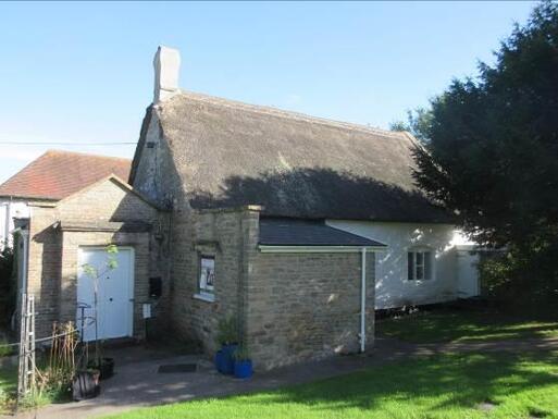 Modest rubble stone constructed meeting house retains historic furnishings.