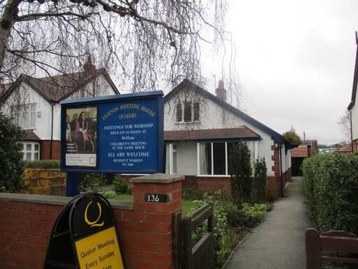 Post-war house hidden from the street frontage with a sign 'Friends Meeting House'.