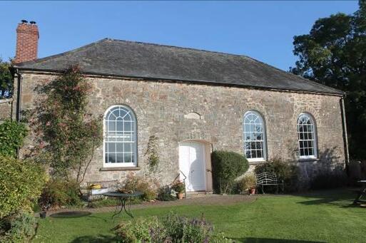 Handsome stone building in a very attractive rural setting.