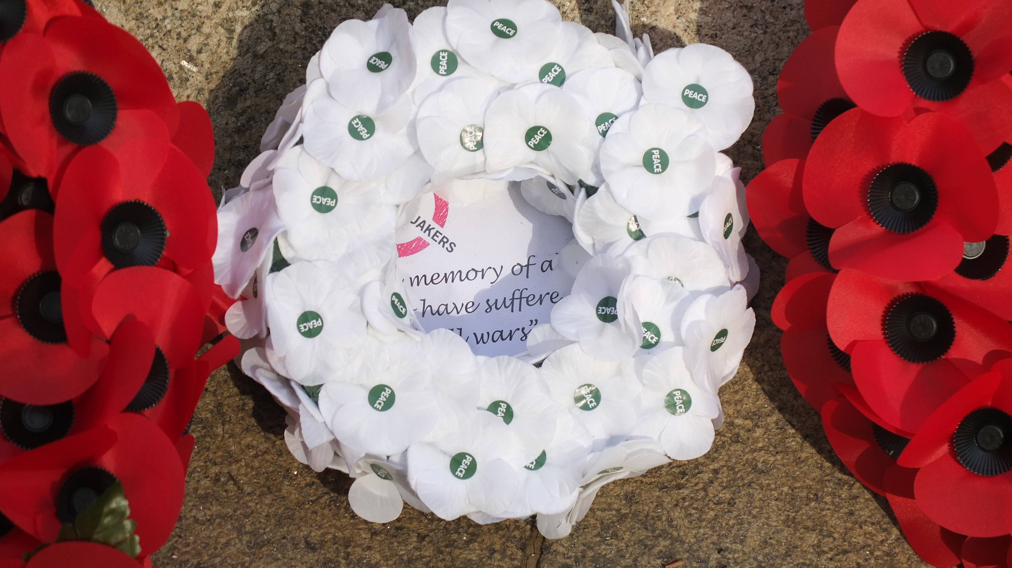 Wreaths of red and of white poppies