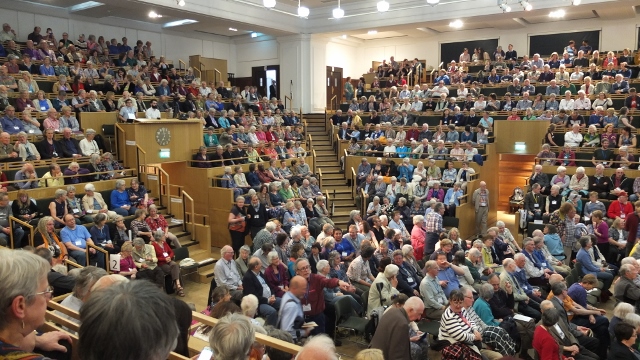 Friends gathering for Yearly Meeting session in the Large Meeting House, Friends House