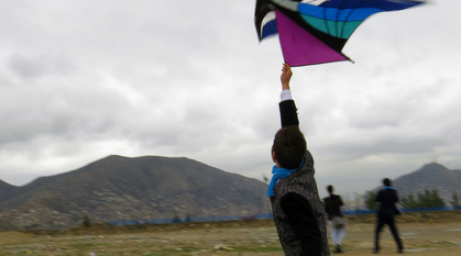 Abdulhai with a kite in Afghanistan