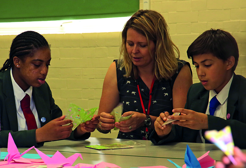 Young people learn about peace at a London school. Image: Di Tatham for BYM