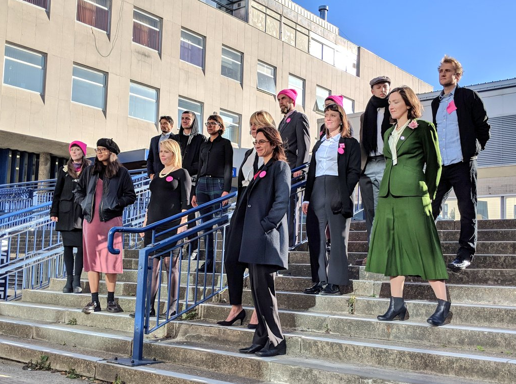 15 defendants on steps outside court