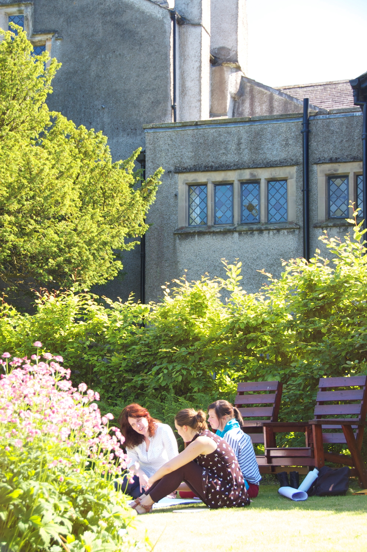 Course discussion group. Swarthmoor Hall quiet garden in summer