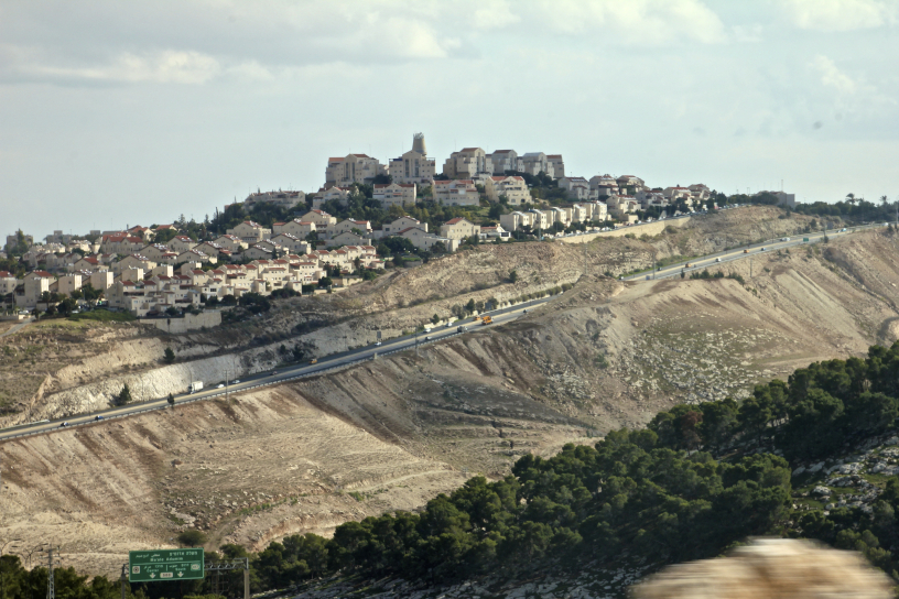 newly built settlement houses atop hill