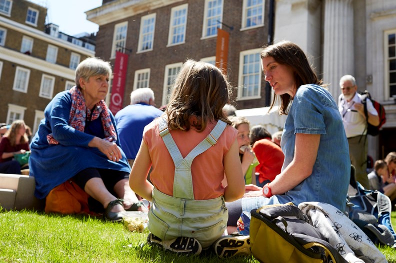 People sitting on a lawn