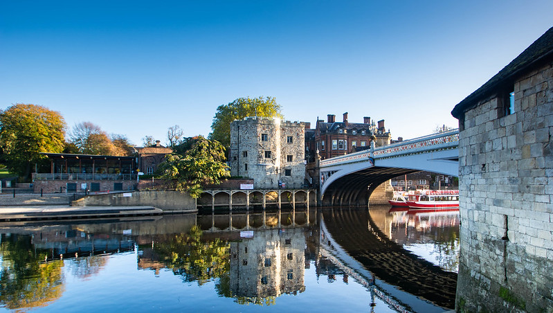 An image of York. The river with a bridge. It is a sunny day. 