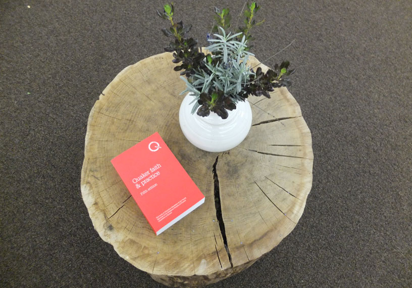 red book on a table with flowers