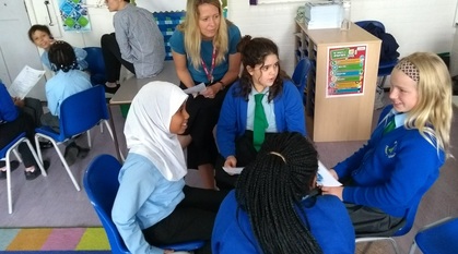 four children sat together discussing something