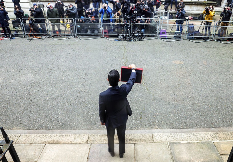 chancellor with red case faces press