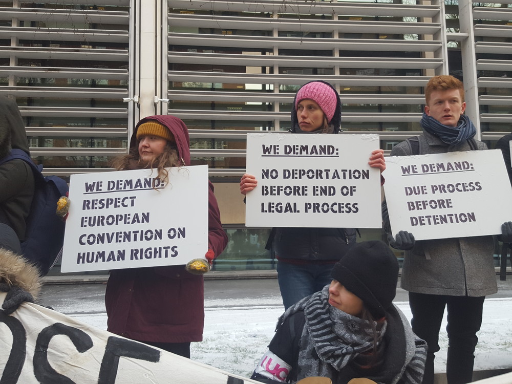 Protestors holding banners