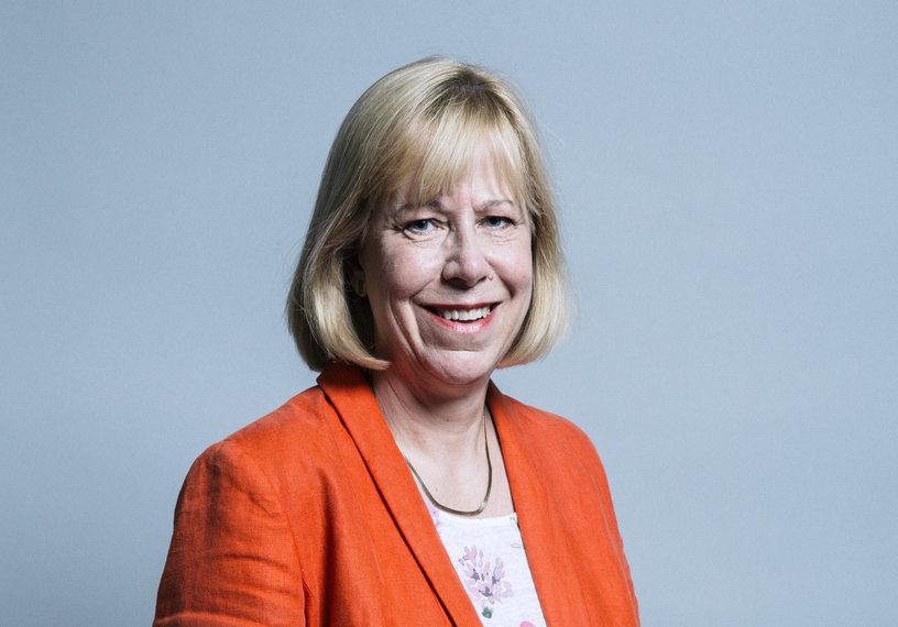 Blonde woman wearing orange