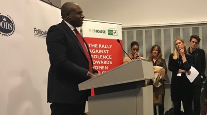 David Lammy MP giving a speech standing at a lectern in a conference meeting room
