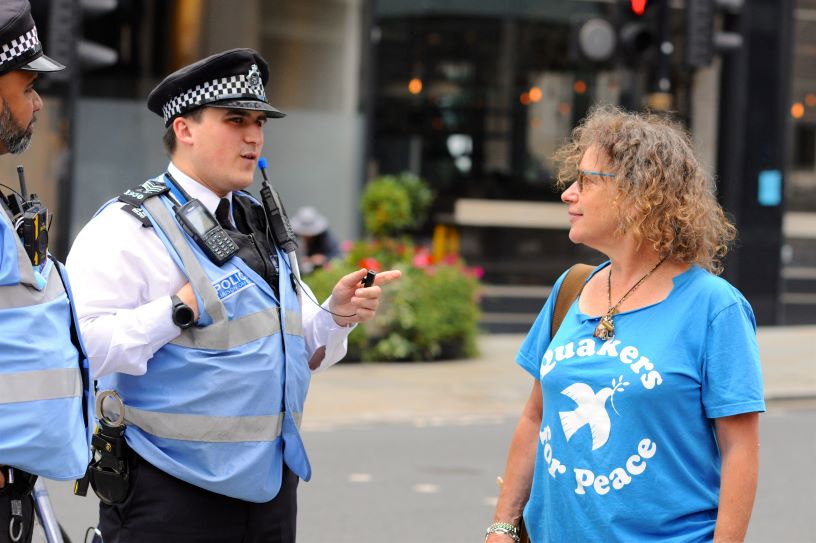 woman talking to two police officers