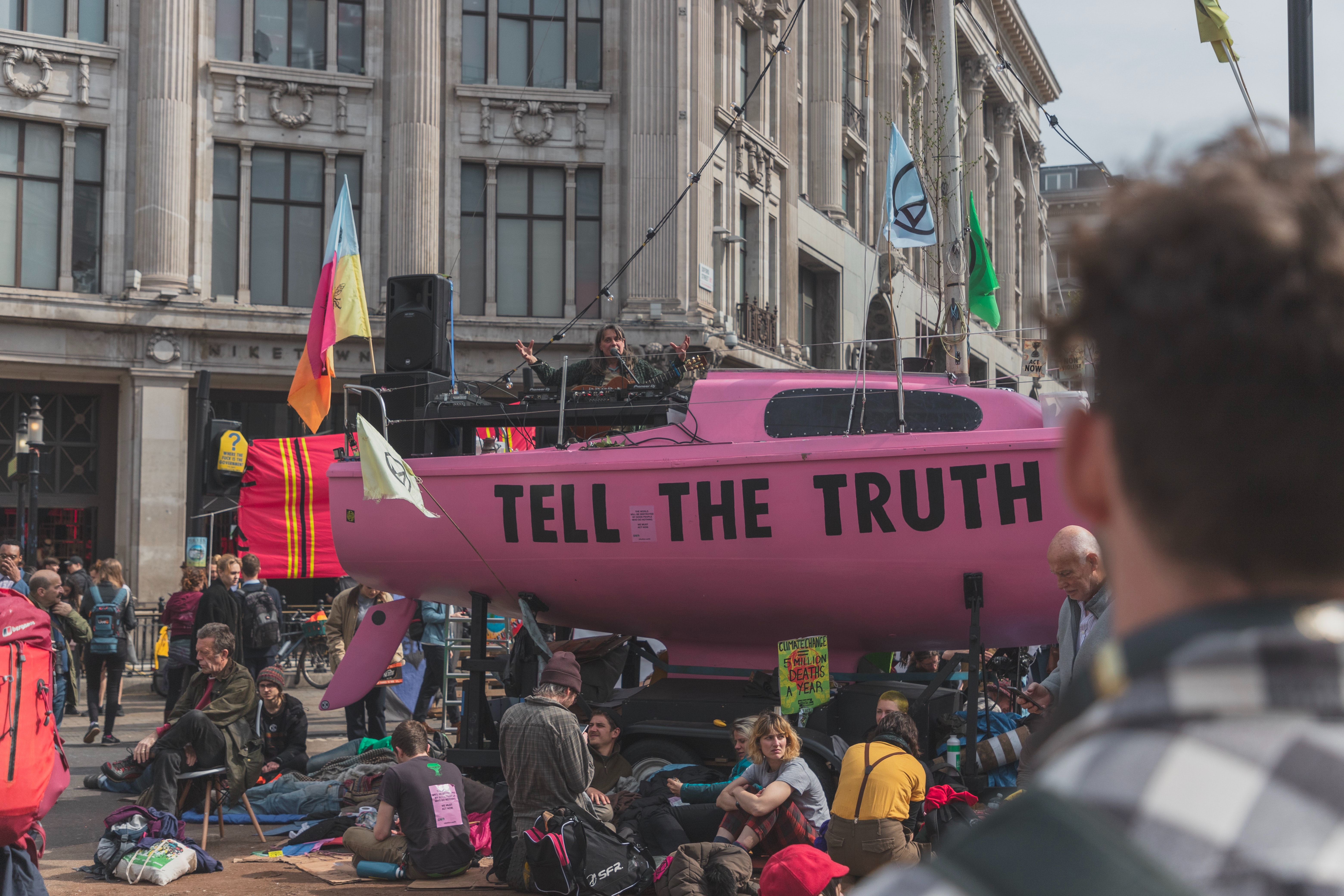 Protest in the middle of the road - boat with tell the truth - Photo by Joël de Vriend on Unsplash