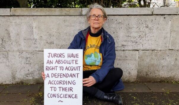 woman holding placard