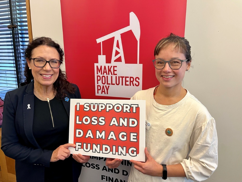 Two women holding a placard