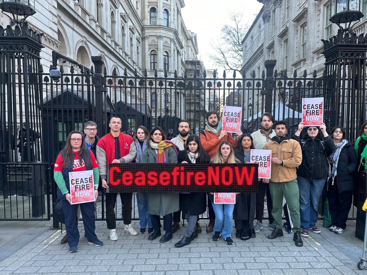 NGOs gathered outside Downing Street with 'Ceasefire NOW' banners and placards