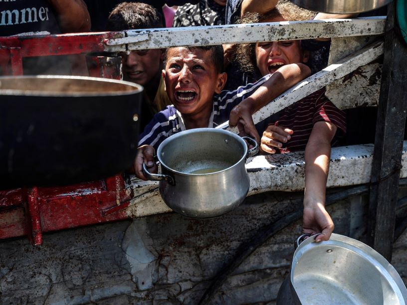 Distressed child surrounded by empty pots