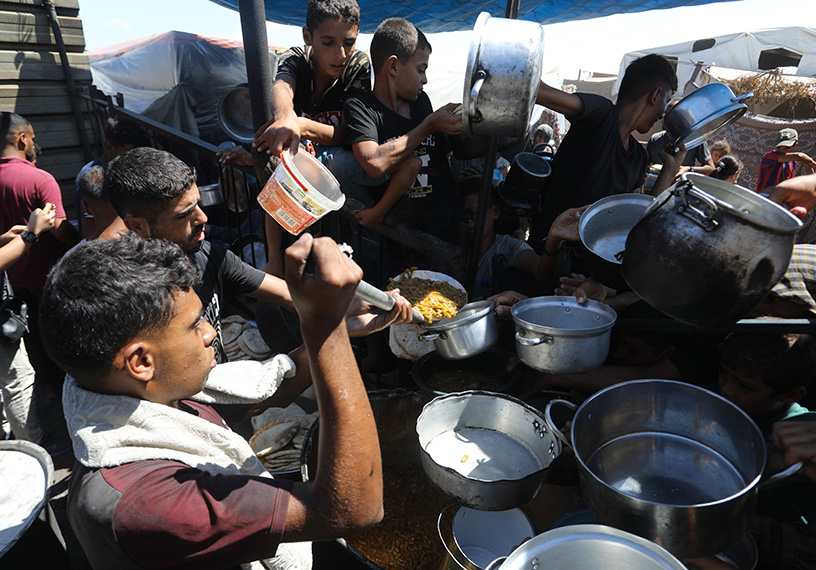 Food being dished out to waiting people