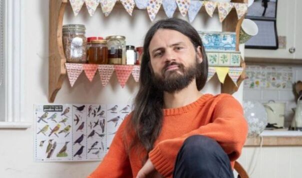 man in orange jumper