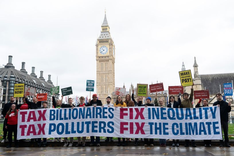 People standing with long banner in front of Big Ben