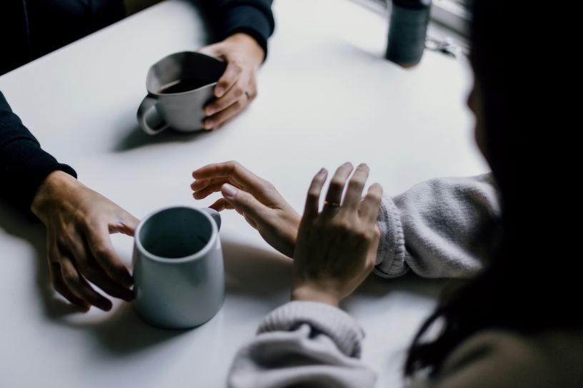 Hands and coffee cups
