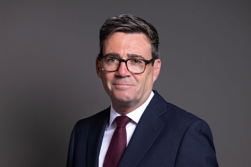 Man wearing glasses and suit and tie