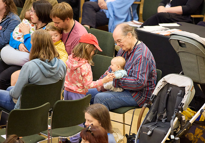 Families in a meeting room